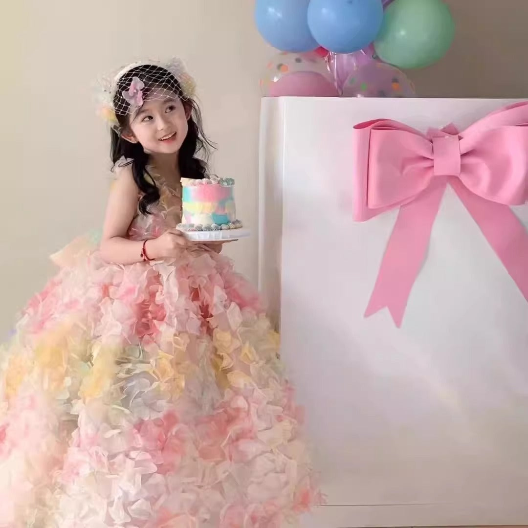 Pastel multicolor 3D petal girls ball gown with sleeveless V-neck and sheer back bow, designed for birthdays, weddings and photoshoots.