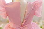 Back of the dusty rose flower girl dress showing the concealed zip and tie.