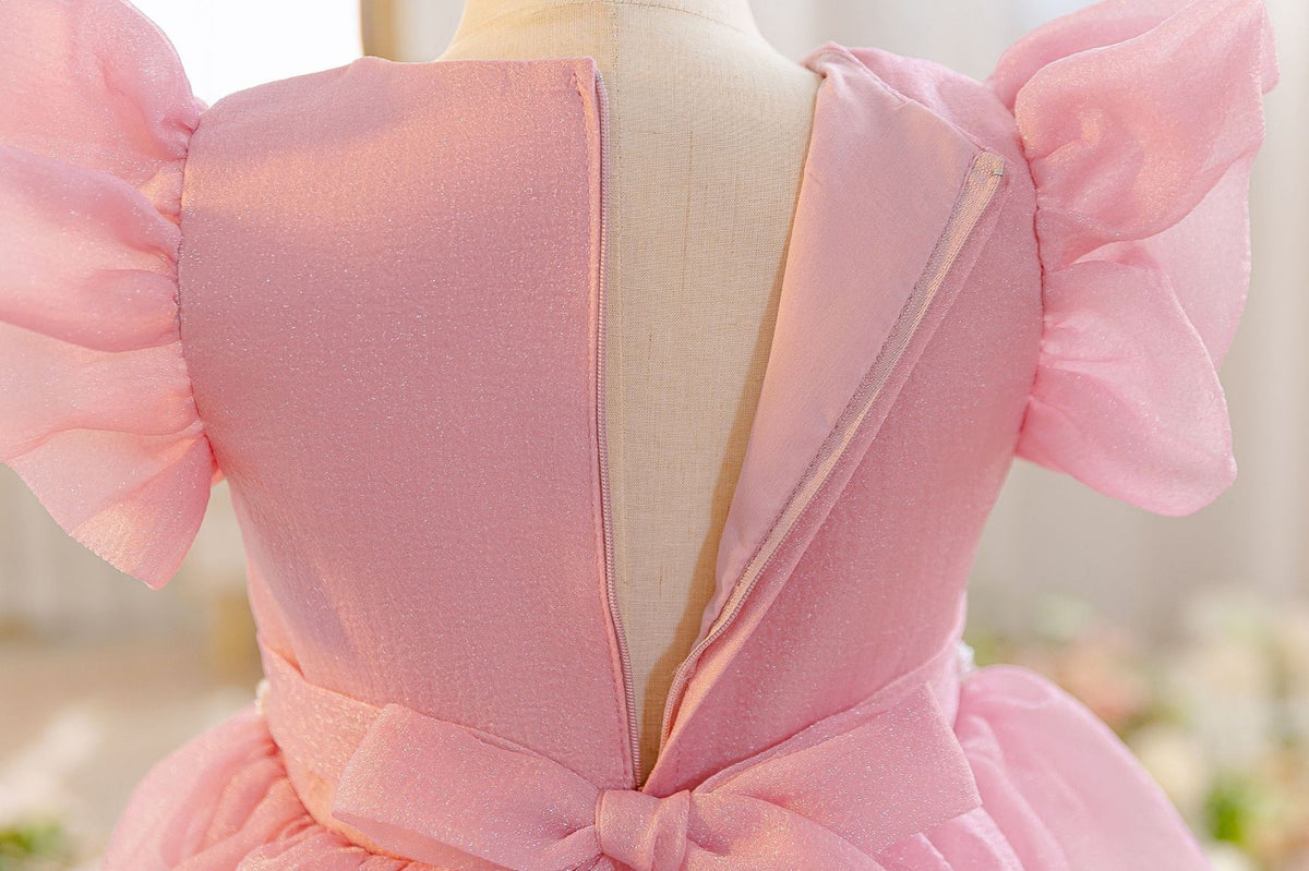 Back of the dusty rose flower girl dress showing the concealed zip and tie.