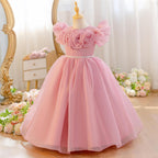 Dusty rose princess dress for girls with a floor length tulle skirt, angled view.