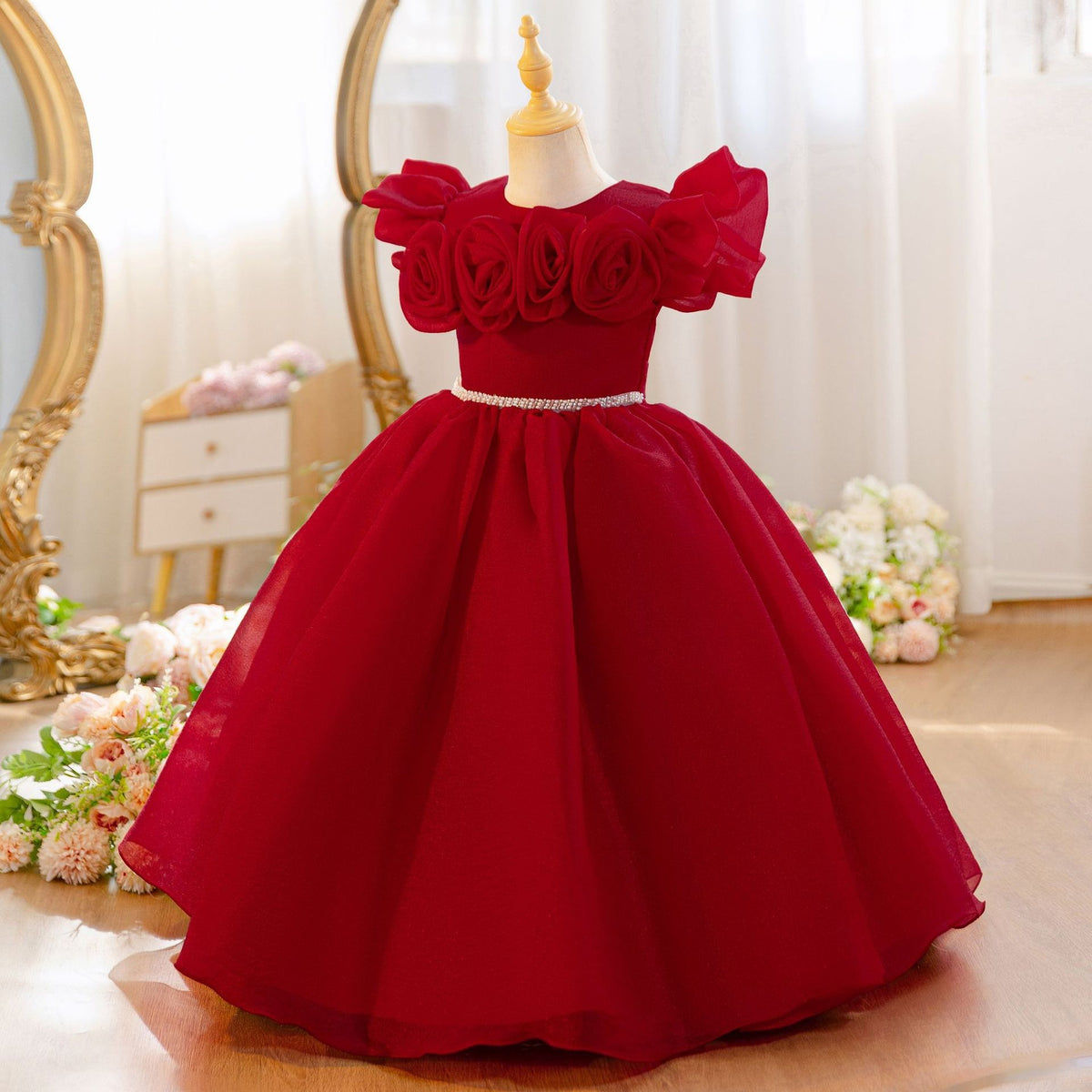 Wine red princess dress for girls with a full tulle ball skirt, angled view.