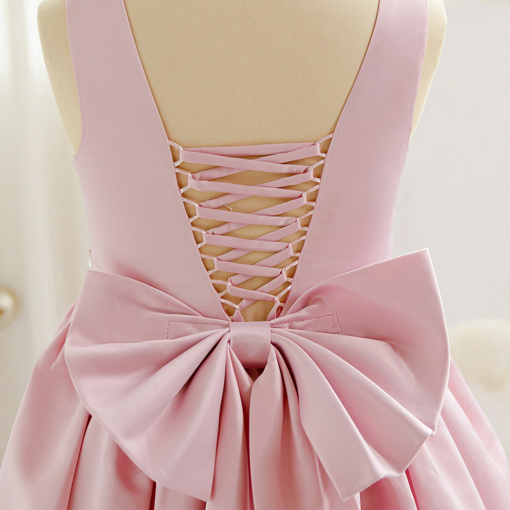 Pink long tulle flower girl dress with bow details