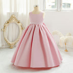 Pink long tulle flower girl dress with bow details