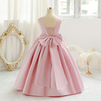 Pink long tulle flower girl dress with bow details
