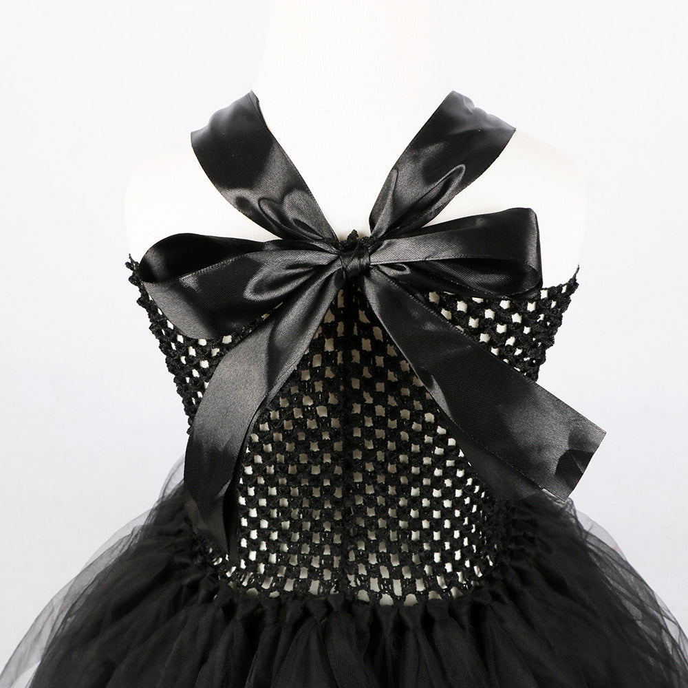 Black girls Halloween dress with satin halter bow and stretch mesh bodice, designed for costume parties.