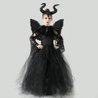 Black tulle girls Halloween costume gown with horned headpiece, feather collar, wings and lace sleeves, designed for Halloween parties.