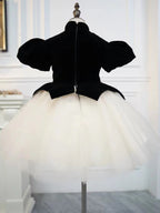 Back view of a black and ivory velvet girls dress with zipper and tulle tutu skirt, designed for birthday parties.