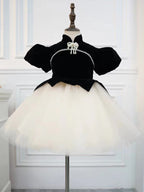 Black and ivory velvet girls dress with pearl bow collar, puff sleeves and tulle tutu skirt, designed for birthday parties.