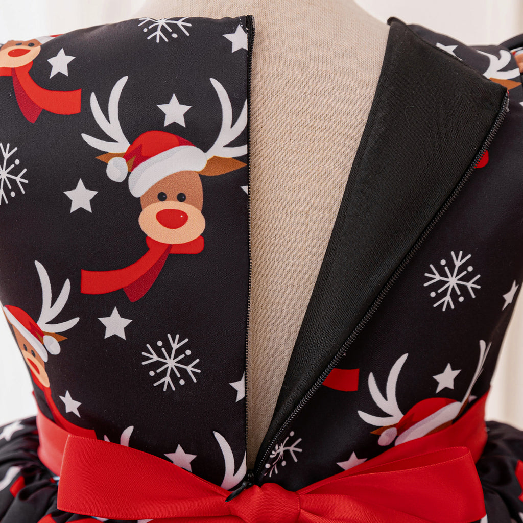 Black and red girls dress with reindeer print bodice, bow peplum and red tulle skirt, designed for Christmas parties, view 7