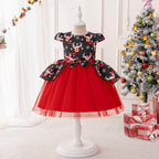 Black and red girls dress with reindeer print bodice, bow peplum and red tulle skirt, designed for Christmas parties.
