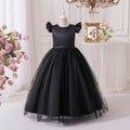 Black satin and tulle girls party dress with flutter sleeves, front view, for a formal party.