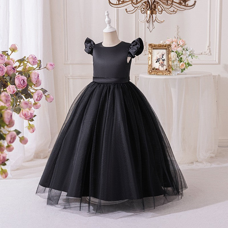 Black dress for girls with a long tulle skirt, angled side view.