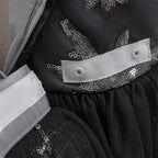 Inside view of the black girls gown showing the lined bodice and waist finishing.