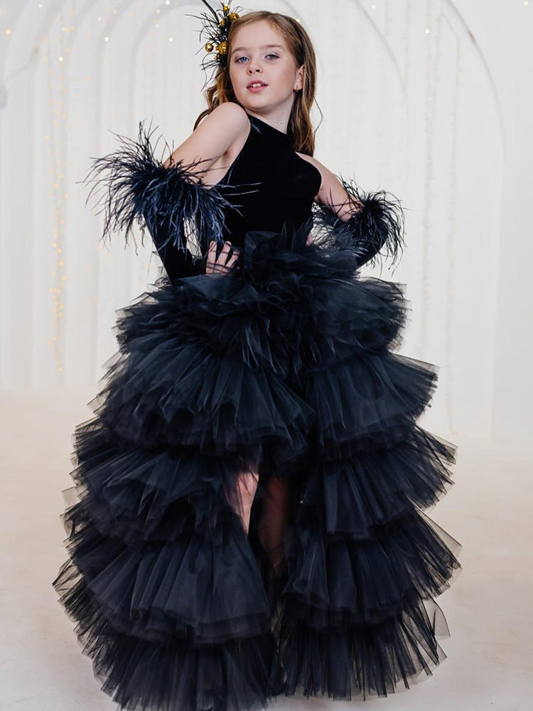 Black velvet girls tulle gown with halter neck, bow open back and tiered high-low ruffle skirt, designed for birthdays and pageants, view 2
