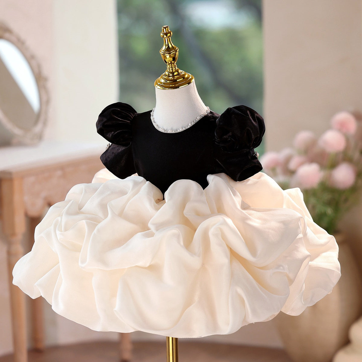 Ivory organza bubble skirt under the black velvet bodice, side view, for a holiday party.