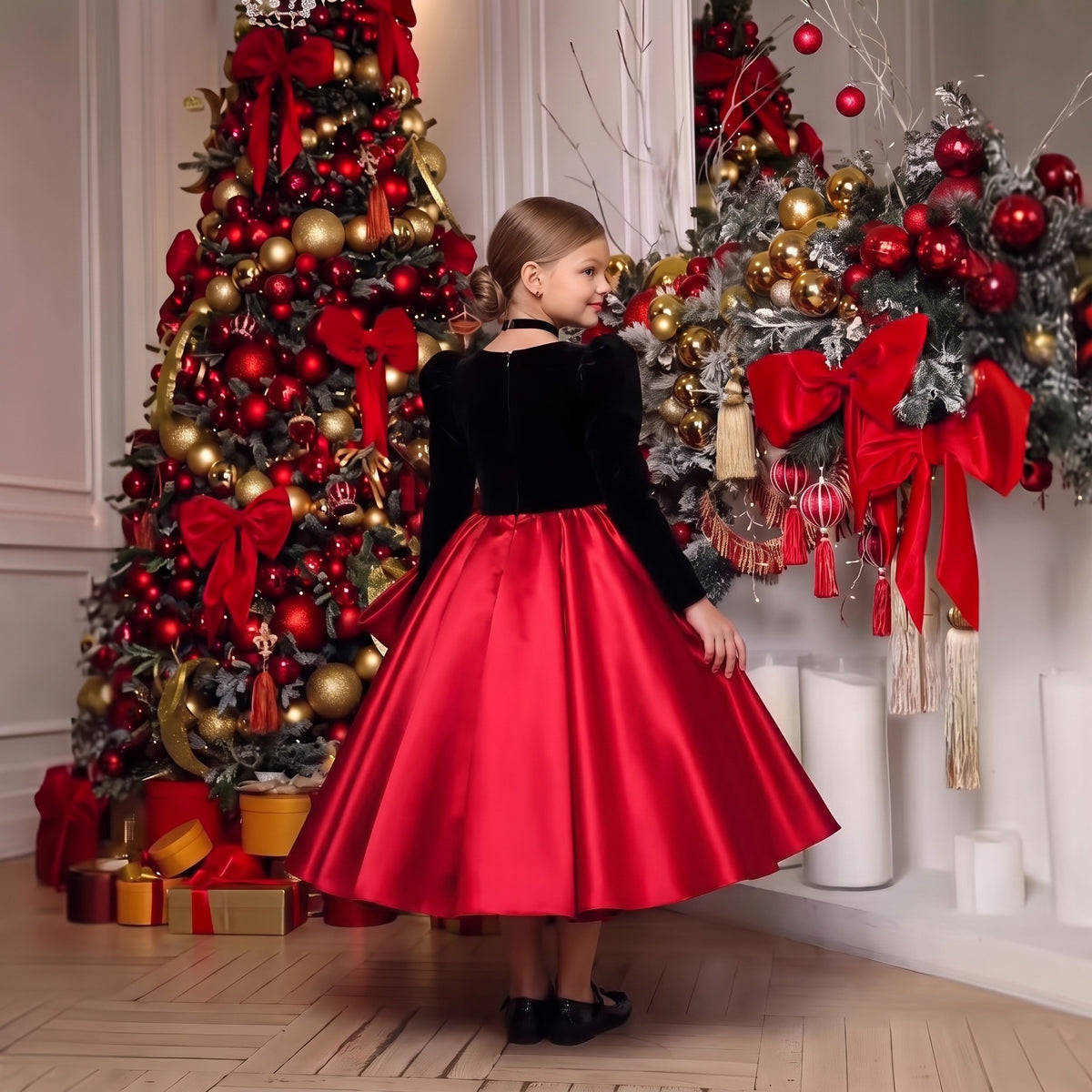 Back view of girls black velvet and red satin holiday dress with puff sleeves, hidden zipper and full satin skirt