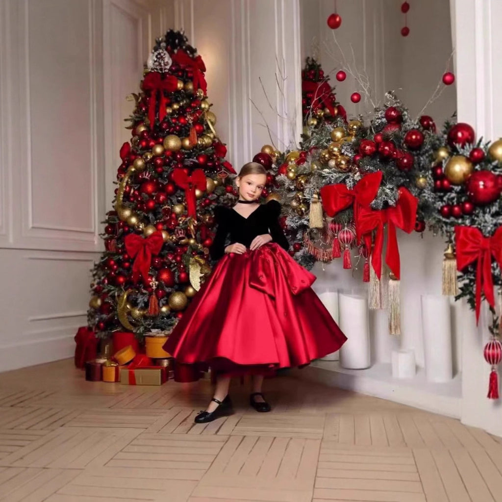 Black and red velvet and satin girls dress with V-neck and full tea-length skirt, designed for Christmas photos.