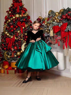 Black and green velvet and satin girls dress with long puff sleeves and full skirt, designed for holiday photos.