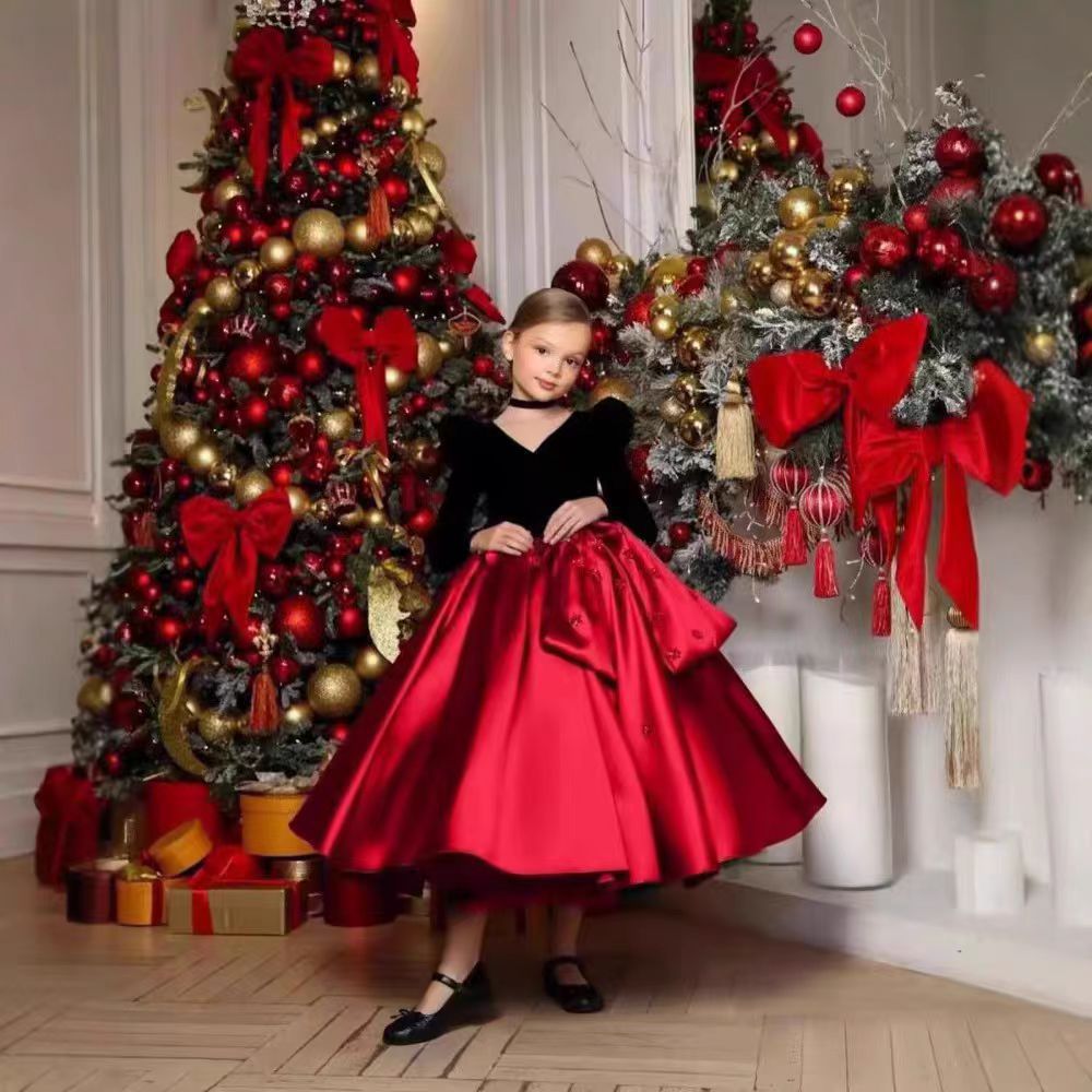Black and red velvet and satin girls dress with long puff sleeves, beaded flowers and hip bow, designed for Christmas parties.