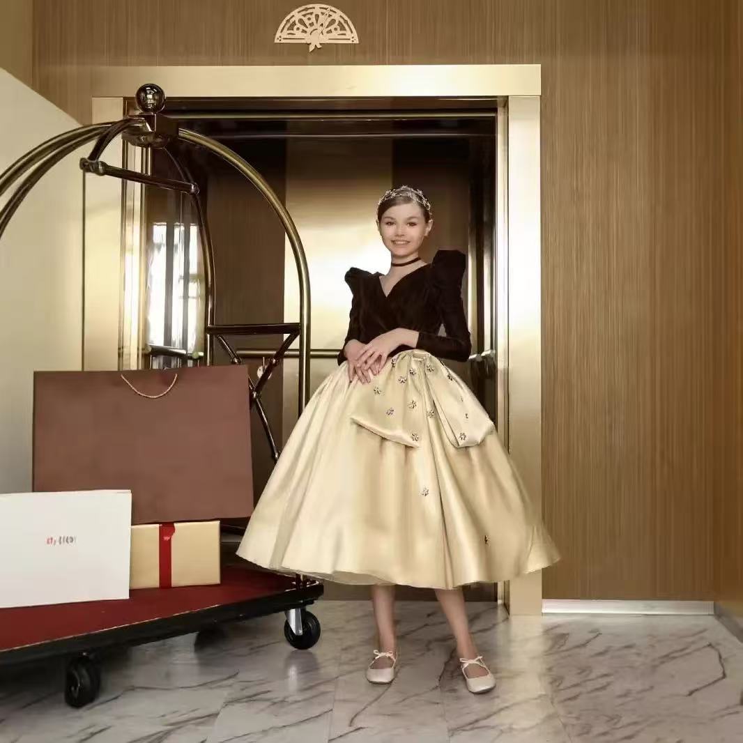 Brown and champagne velvet and satin girls dress with long puff sleeves, beaded flowers and hip bow, designed for holiday events.