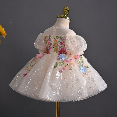 Back view of the blush floral girls birthday dress showing the concealed back zip and embroidered bodice.