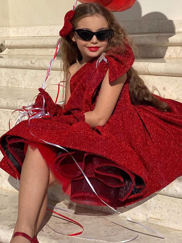 Burgundy glitter girls party dress with one-shoulder bow neckline and puffy knee-length skirt, designed for birthdays and Christmas parties, view 2