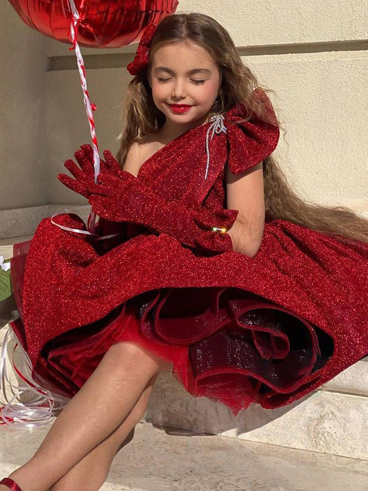 Burgundy glitter girls party dress with one-shoulder bow neckline and puffy knee-length skirt, designed for birthdays and Christmas parties.
