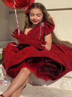 Burgundy glitter girls party dress with one-shoulder bow neckline and puffy knee-length skirt, designed for birthdays and Christmas parties.