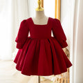 Burgundy satin girls party dress with a square neckline and long puff sleeves, front view, for birthday girls dresses.