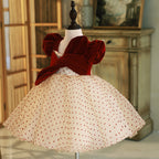 Burgundy velvet girls party dress with wrap-front bodice and full champagne tulle skirt, designed for birthdays and weddings.