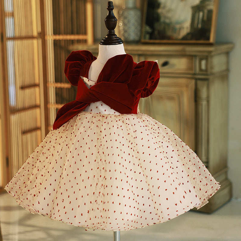 Burgundy velvet girls party dress with wrap-front bodice and full champagne tulle skirt, designed for birthdays and weddings.
