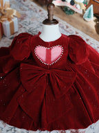Burgundy velvet girls party dress with long puff sleeves, sheer yoke and pearl heart back bow, designed for Christmas and holiday parties, view 5