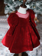 Burgundy velvet girls party dress with long puff sleeves, sheer yoke and pearl heart back bow, designed for Christmas and holiday parties.