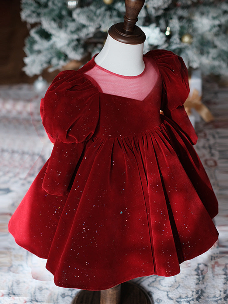 Burgundy velvet girls party dress with long puff sleeves, sheer yoke and pearl heart back bow, designed for Christmas and holiday parties.