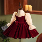 Burgundy velvet girls dress with champagne lace puff sleeves, pearl-center bow and full knee-length skirt, designed for Christmas and holiday parties, view 2
