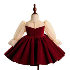 Burgundy velvet girls dress with champagne lace puff sleeves, pearl-center bow and full knee-length skirt, designed for Christmas and holiday parties, view 5