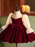 Burgundy velvet girls dress with champagne lace puff sleeves, pearl-center bow and full knee-length skirt, designed for Christmas and holiday parties, view 8