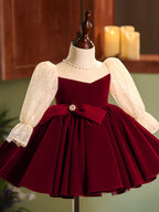 Burgundy velvet girls dress with champagne lace puff sleeves, pearl-center bow and full knee-length skirt, designed for Christmas and holiday parties, view 9