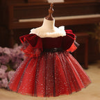 Burgundy velvet girls dress with pearl-trimmed ruffle collar, ruffle sleeves, black bow sash and sparkle tulle skirt, designed for Christmas and holiday parties, view 2