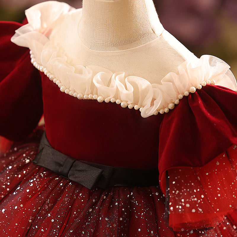 Burgundy velvet girls dress with pearl-trimmed ruffle collar, ruffle sleeves, black bow sash and sparkle tulle skirt, designed for Christmas and holiday parties, view 3
