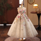 Champagne glitter tulle girls gown with a flower-covered bodice and full ankle-length skirt, designed for pageants and recitals.