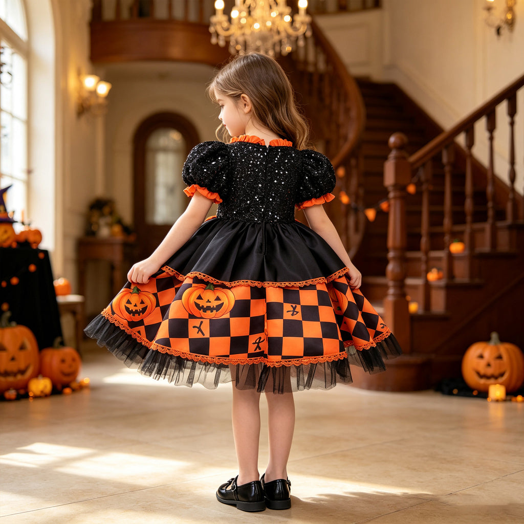 Black and orange girls dress with a sequin puff-sleeve bodice and checkered satin skirt, designed for Halloween parties, view 3