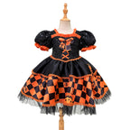 Black and orange girls dress with a sequin puff-sleeve bodice and checkered satin skirt, designed for Halloween parties, view 4