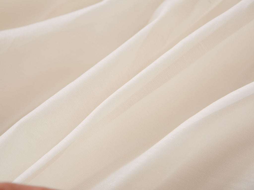 Soft cream chiffon fabric of the girls party dress, designed for birthdays and fall family photos.