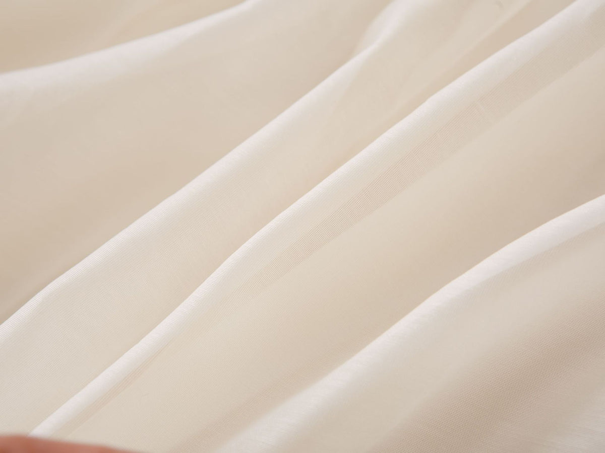 Soft cream chiffon fabric of the girls party dress, designed for birthdays and fall family photos.