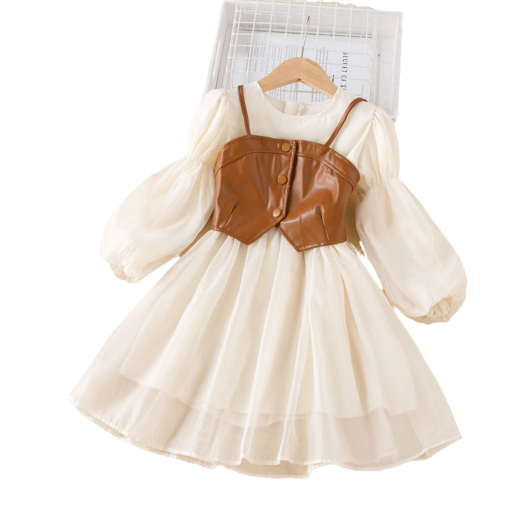 Cream chiffon girls A-line dress with brown faux leather bustier vest and puff sleeves, designed for fall family photos.