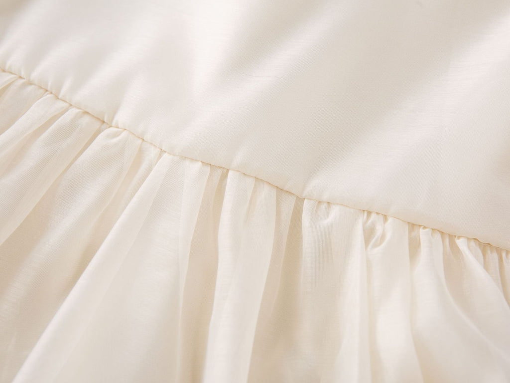 Gathered waist seam of the cream chiffon girls A-line dress, designed for parties and family photos.