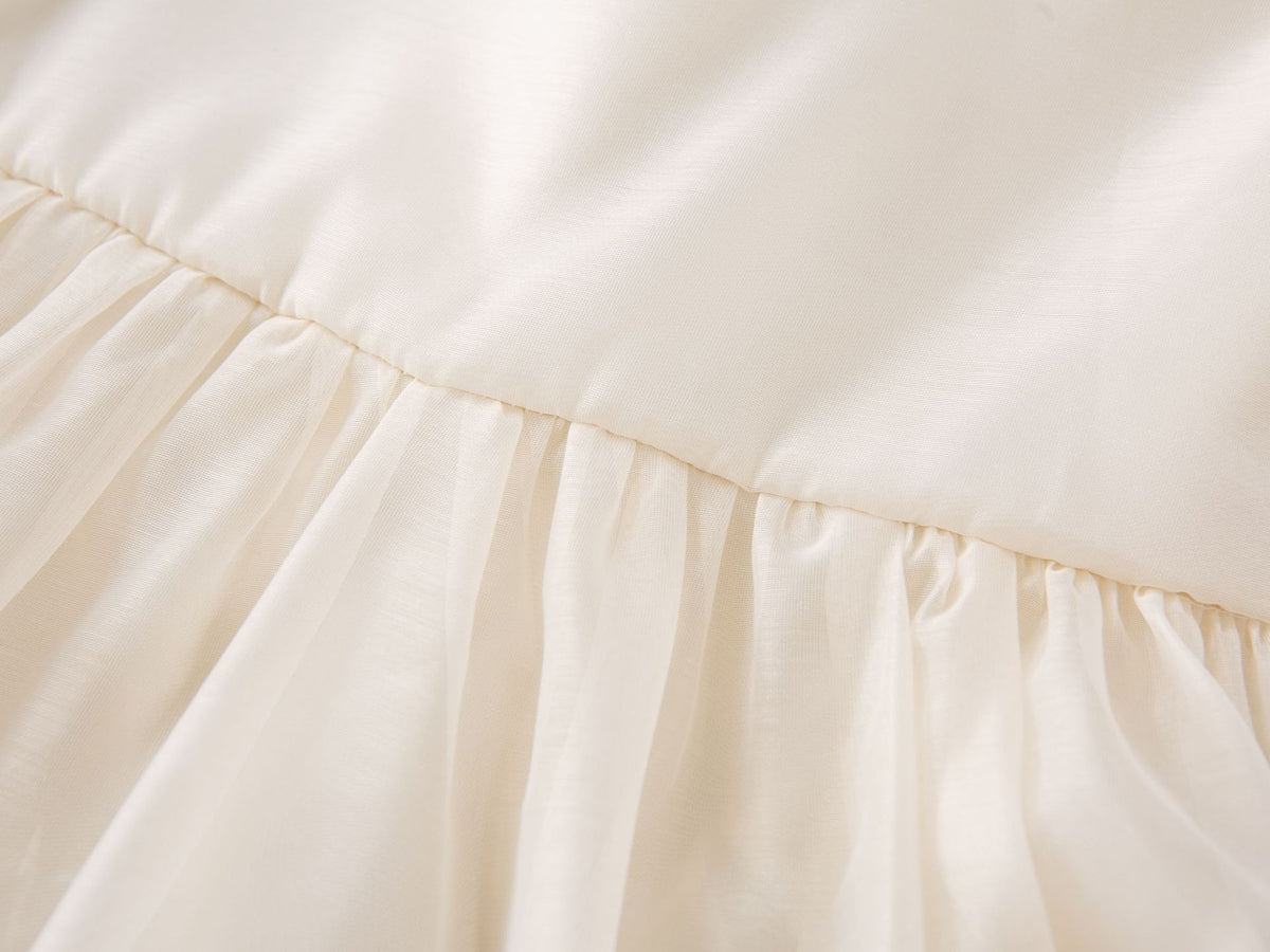 Gathered waist seam of the cream chiffon girls A-line dress, designed for parties and family photos.