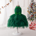 Dark green tulle girls dress with flower-trimmed halter neck, sequin bow waist and tiered tutu skirt, designed for Christmas parties.