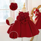 Deep red girls dress with close-ups of the 3D rose, lined bodice and skirt pleats.